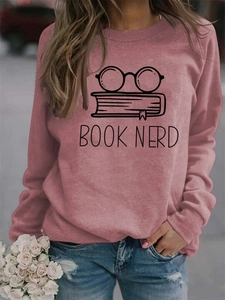 Close-up of pink Book Nerd print sweatshirt with glasses and books graphic detail