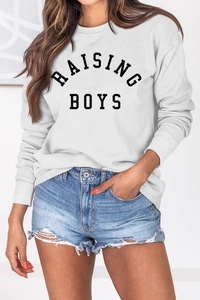Detail of Raising Boys print on white crewneck sweatshirt with ribbed cuffs and hem
