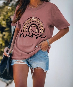 Detail of pink nurse t-shirt with rainbow leopard heart and stethoscope print