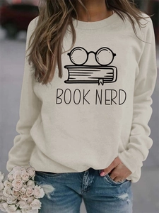 Detail of Book Nerd print on cream crewneck sweatshirt with glasses and books graphics