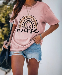 Close-up of nurse rainbow leopard heart print on soft pink cotton short sleeve t-shirt
