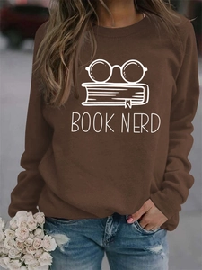 Detail of a dark brown long-sleeve sweatshirt featuring the Book Nerd glasses and book print