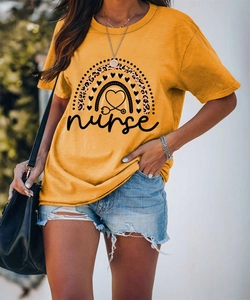 Detail of ginger yellow nurse T-shirt with leopard rainbow print and script lettering