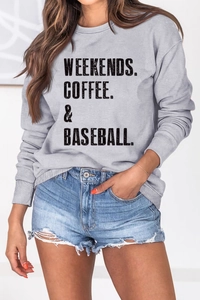 Detail of grey crewneck sweatshirt featuring Weekends Coffee Baseball printed text