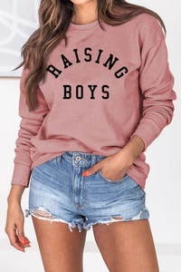 Detail of the Raising Boys letter print on a dusty pink long sleeve casual sweatshirt