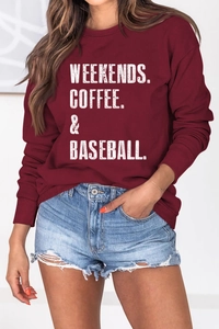 Detail of burgundy long sleeve sweatshirt with Weekends Coffee & Baseball slogan