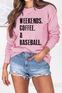 Detail of pink long-sleeve sweatshirt with black Weekends Coffee Baseball text print