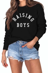 Detail of white RAISING BOYS print on black long-sleeve sweatshirt with ribbed cuffs