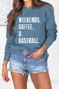 Detailed close-up of retro grey-blue crewneck sweatshirt with white graphic text print