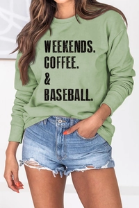 Detail of sage green crewneck sweatshirt with Weekends Coffee Baseball text print