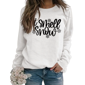 Detail of white long sleeve sweatshirt with i smell SNOW text and snowflake print