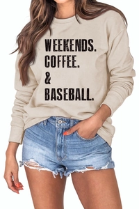 Detail of beige sweatshirt featuring Weekends Coffee & Baseball print with denim shorts