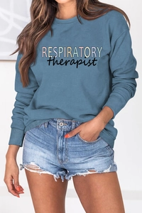 Detail of blue Respiratory Therapist sweatshirt lettering and soft cotton texture