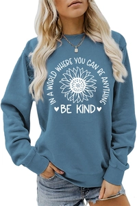 Detail of sunflower print and be kind quote on navy long sleeve crewneck sweatshirt
