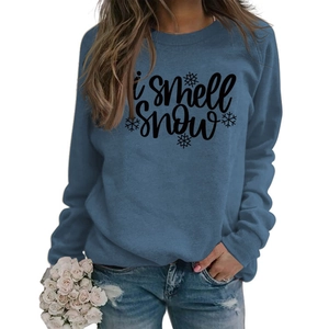 Detail of grey blue sweatshirt featuring I smell snow lettering and snowflake graphic