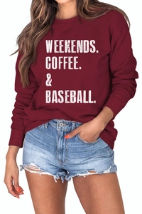 Detail of burgundy sweatshirt featuring Weekends Coffee Baseball text and ribbed crewneck