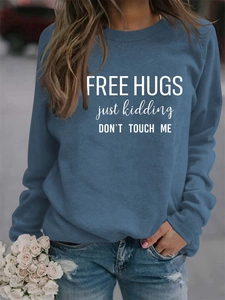 Detail of Free Hugs slogan print on long sleeve navy blue crewneck sweatshirt for women