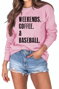Detail of pink cotton sweatshirt with WEEKENDS COFFEE BASEBALL text and denim shorts