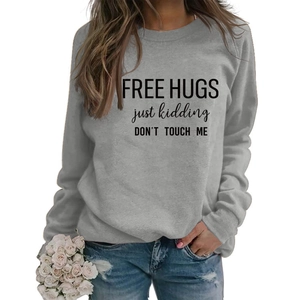 Detail of grey crewneck sweatshirt with black Free Hugs Just Kidding slogan print