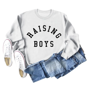 Flat lay of white RAISING BOYS sweatshirt styled with denim jeans and sneakers