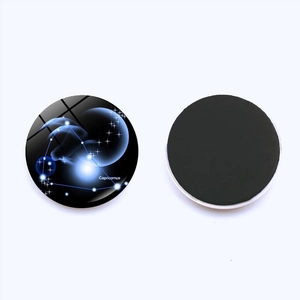 Detail of Capricorn glass fridge magnet showing blue nebula pattern and magnetic back