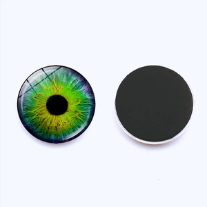 Green cat eye glass magnet for fridge with realistic iris pattern in 25mm diameter