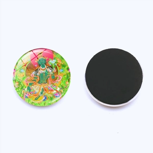 Detail view showing Green Tara art glass cabochon and strong round magnetic back