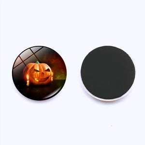 Detailed front and back view of 25mm glass pumpkin magnet for Halloween fridge decor