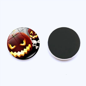 Detailed view of Halloween glass fridge magnet showing pumpkin pattern and magnetic back
