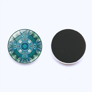 Round mandala glass refrigerator magnet set with blue geometric pattern and magnetic back