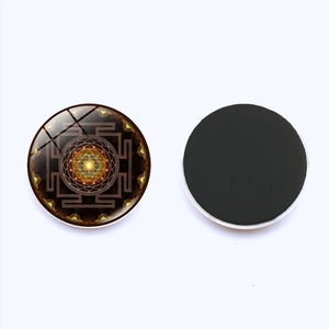 Sri Yantra Mandala glass refrigerator magnet with gold geometric pattern and magnetic back