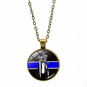 Detail of blue line police badge necklace with vintage bronze finish and knight pendant