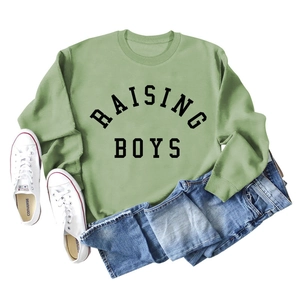 Detail of Sage Green sweatshirt with Raising Boys print and cotton texture close-up