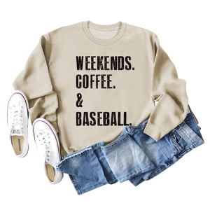 Detail of WEEKENDS COFFEE & BASEBALL lettering on a beige long-sleeved crewneck sweatshirt