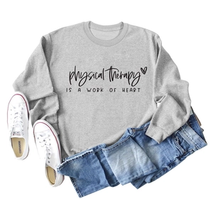 Flat lay of gray long sleeve sweatshirt with physical therapy is a work of heart print