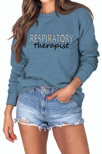 Close-up of Respiratory Therapist artistic colorful text on fog blue sweatshirt