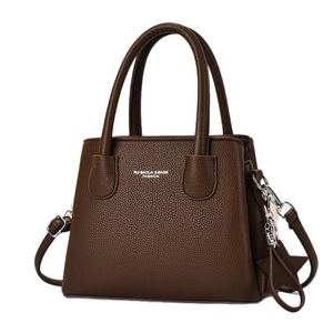 Classic dark brown pebble leather tote bag with top handles and adjustable shoulder strap