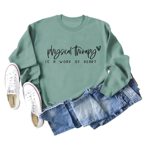 Detail of sage green sweatshirt with Physical Therapy Is A Work Of Heart slogan print