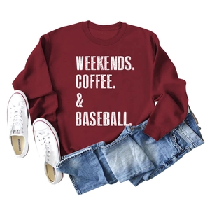 Flat lay of burgundy crewneck sweatshirt with Weekends Coffee Baseball text and jeans