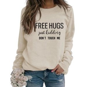 Detail of Free Hugs slogan print on long-sleeve beige crewneck sweatshirt for women