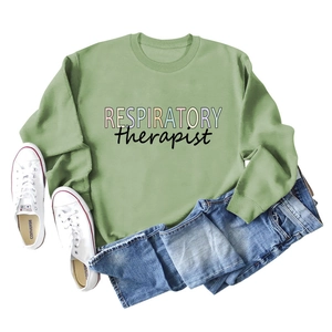 Flat lay of green Respiratory Therapist sweatshirt with blue jeans and sneakers