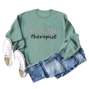 Sage green respiratory therapist sweatshirt with colorful text and navy jeans