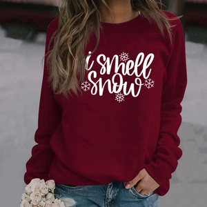 Women's burgundy crew neck sweatshirt with 'i smell snow' graphic and soft texture
