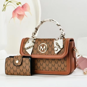 Detail of printed crossbody bag with silk scarf handle and matching small wallet