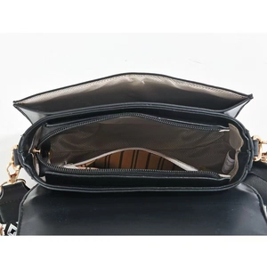 Top view of crossbody bag with dual compartments, zipper pocket and woven strap