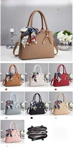 Detailed view of woven texture tote bag with silk scarf and leather handles in multiple colors