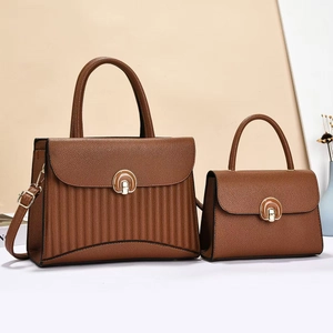 Striped brown pebbled leather tote set with gold semicircular locks and long straps