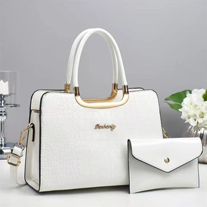 White crocodile pattern handbag set with golden hardware and matching envelope clutch