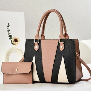 Detail of color-block tote set with envelope pouch in textured faux leather and gold hardware