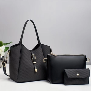 Three-piece black luxury tote bag set with golden hardware and woven texture